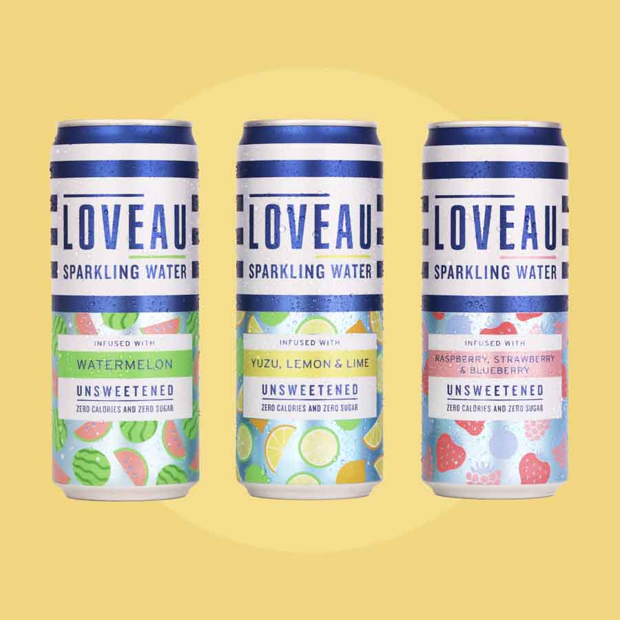 three cans of loveau against a yellow background