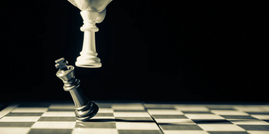 A black and white image of a chess victory